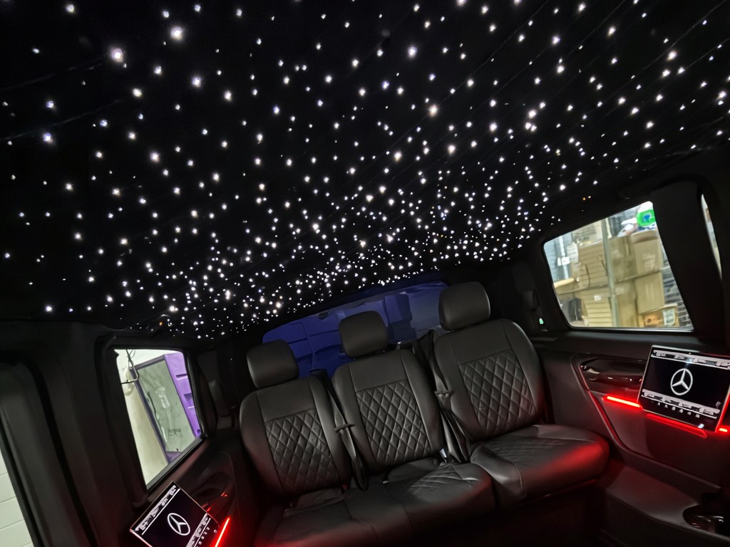Starlight-lit interior of our Mercedes-Benz V-Class chauffeur vehicle with quilted leather seats